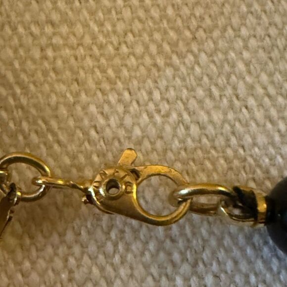 Vintage Monet Signed Black Graduated Bead Necklace with Gold Tone Spacers. - Picture 5 of 5